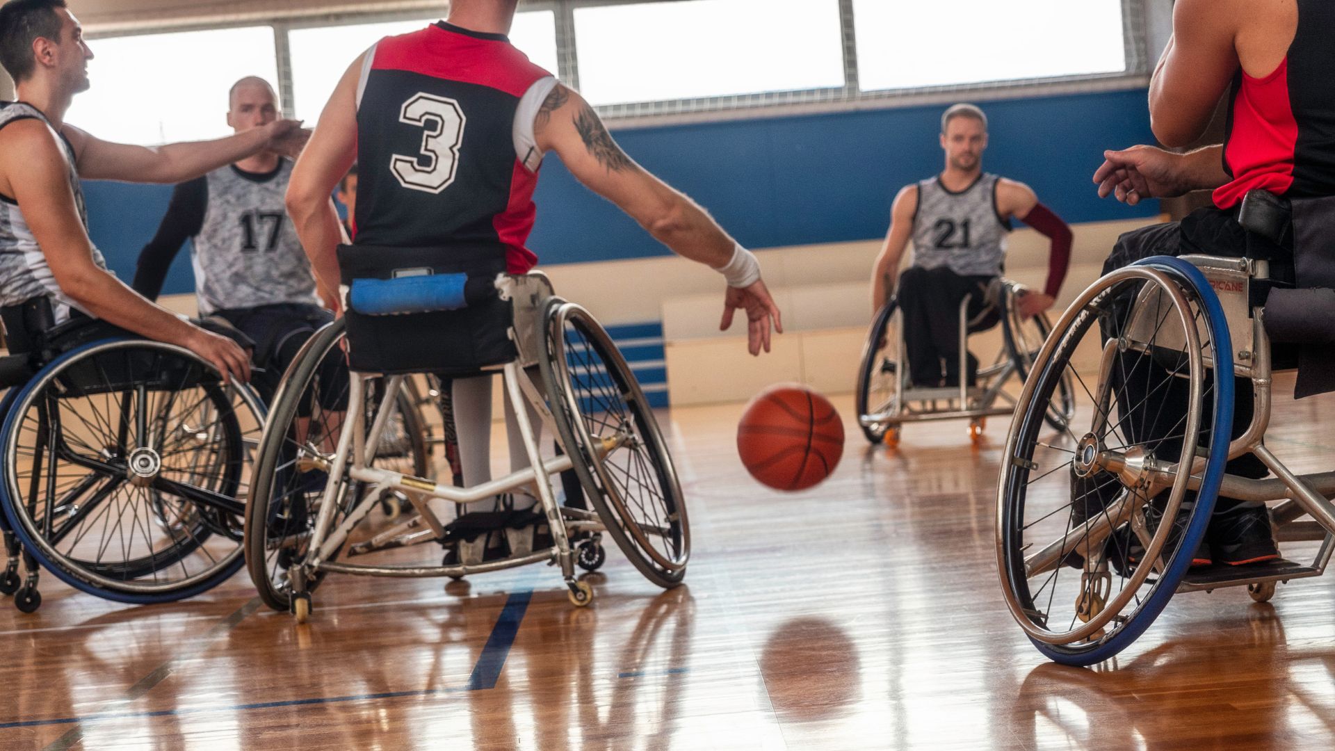 Photo of men playing wheelchair basketball